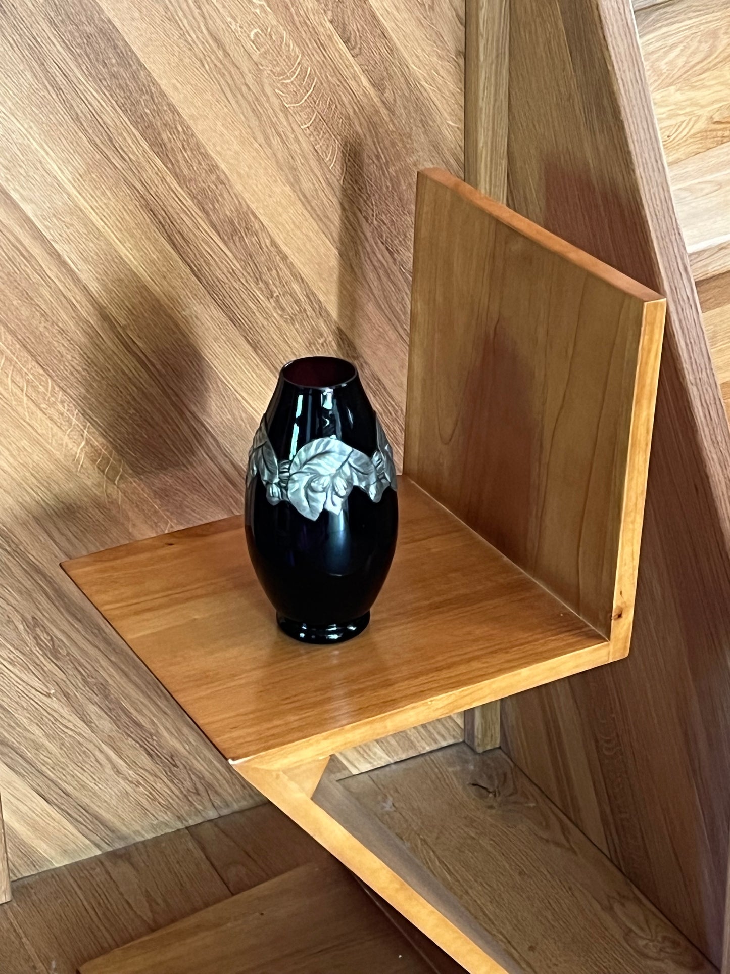 Burgundy glass vase with steel decoration