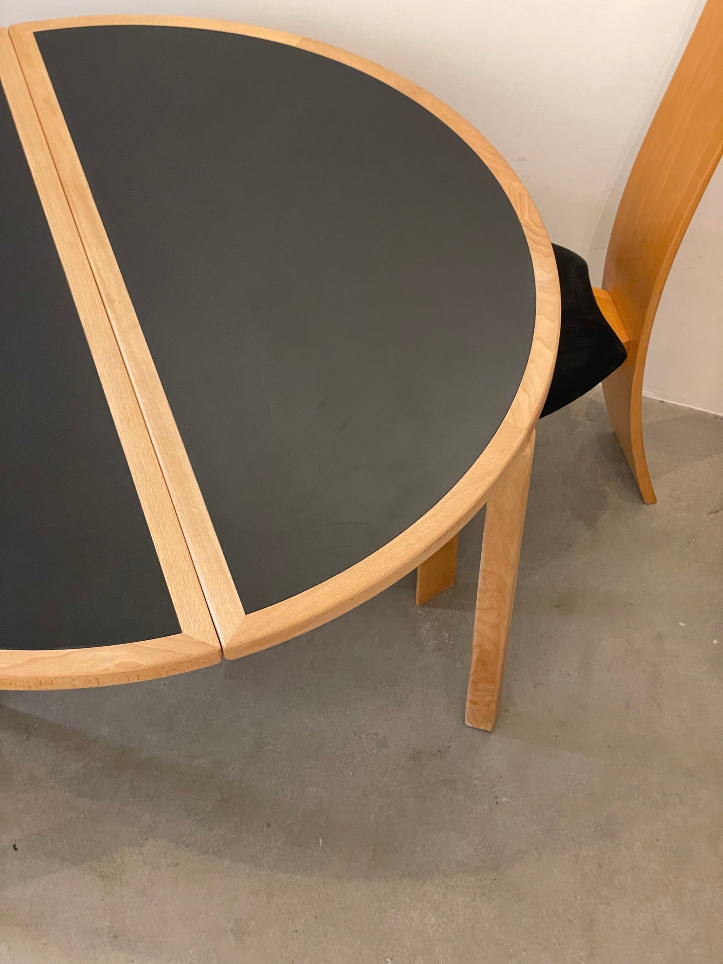 Circular dining table