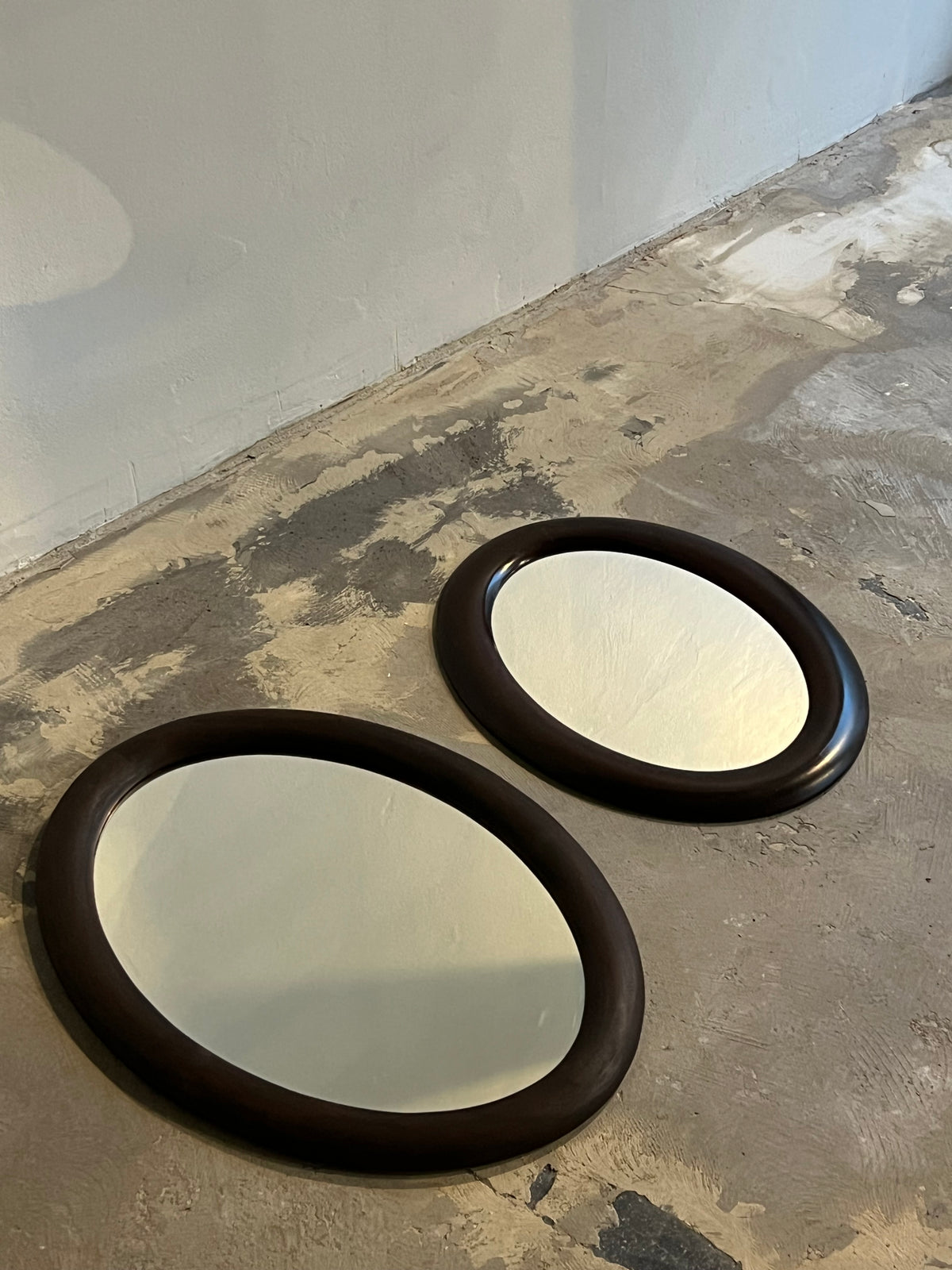 Oval brown wood mirror