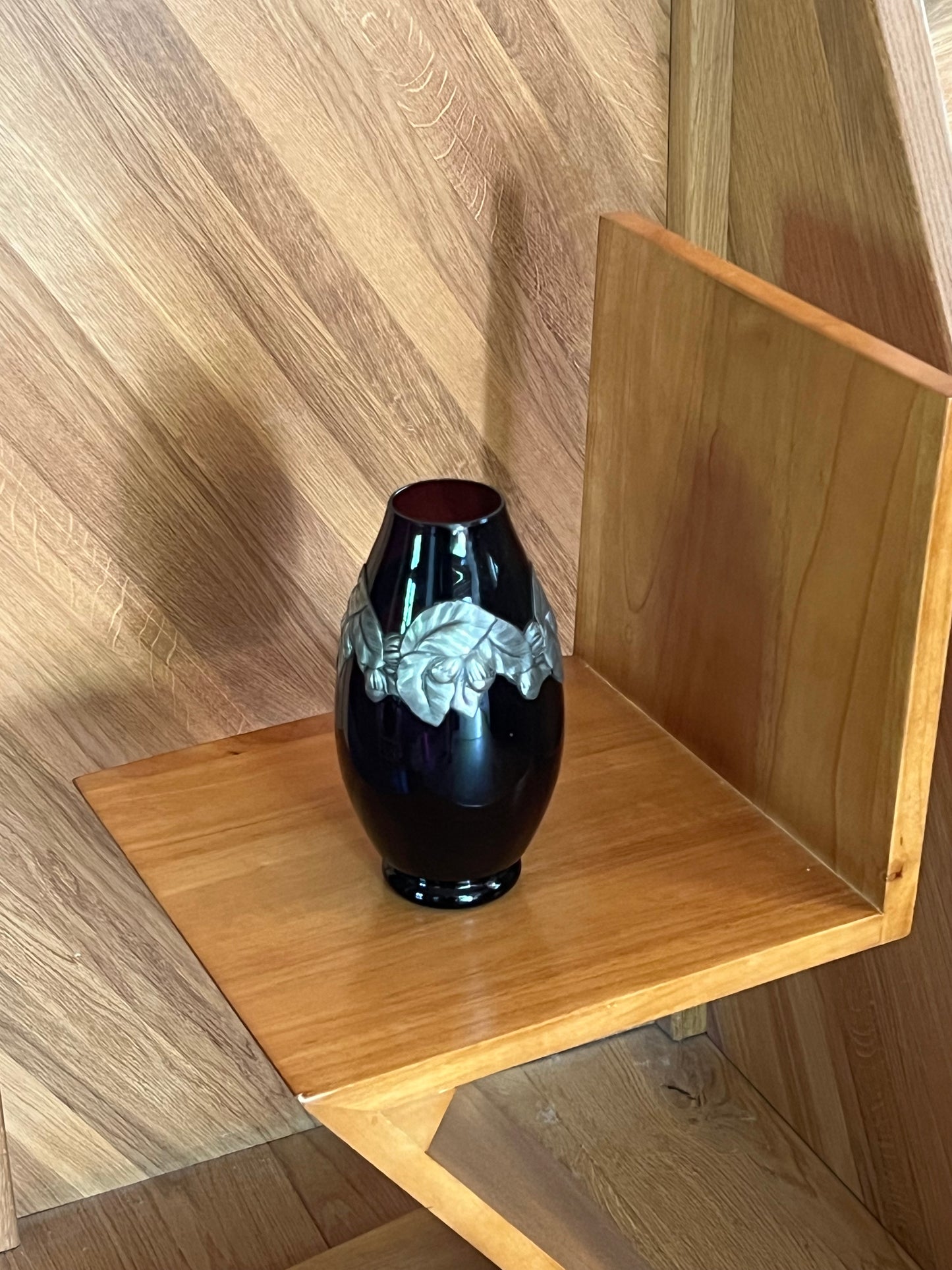 Burgundy glass vase with steel decoration